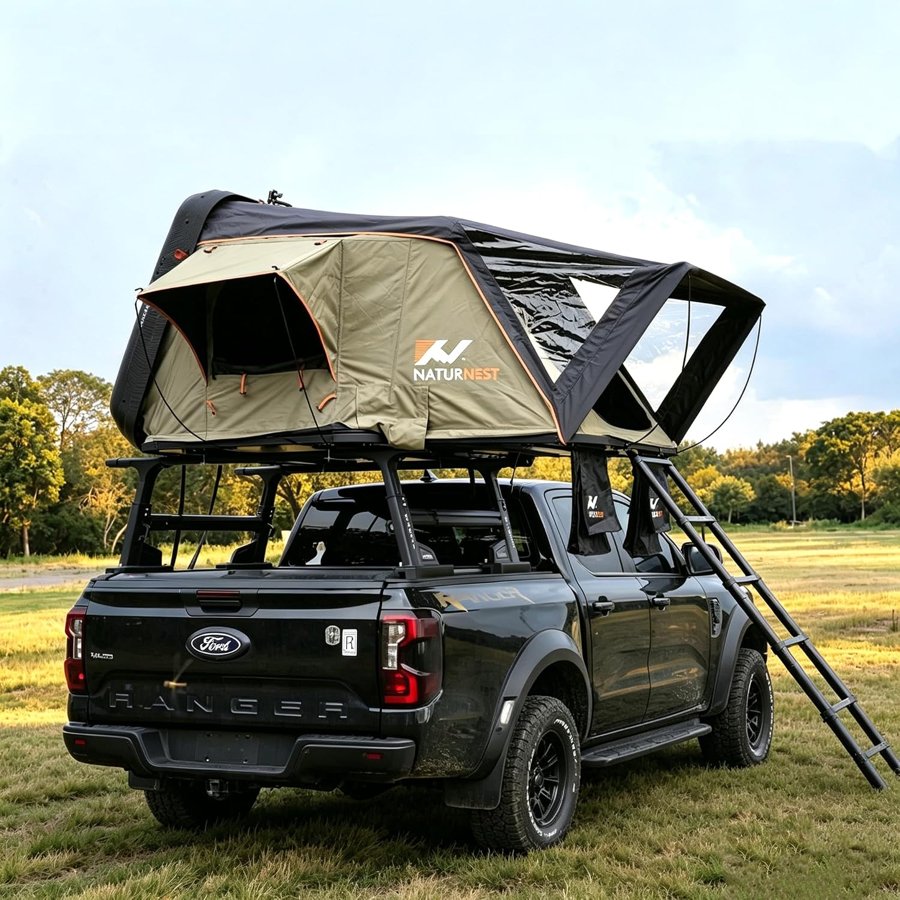 Naturnest Sirius 1 clamshell hardshell rooftop tent open on a pickup truck rack with a ladder